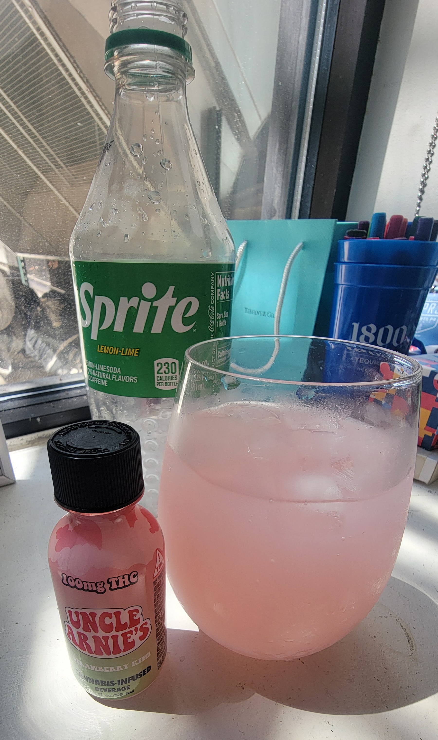 Uncle Arnie's Strawberry Kiwi shot mixed with Sprite on Ice